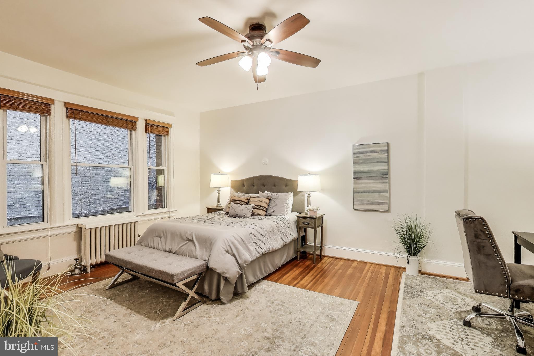 1791 Lanier Place Northwest, Unit 2 Washington, DC 20009 - Photo 21 of 30 a bedroom with a bed and a chair