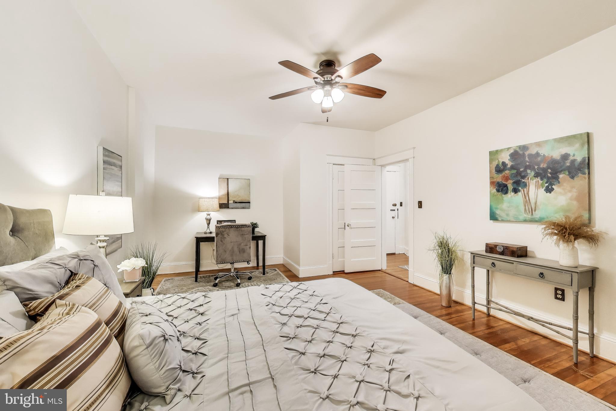 1791 Lanier Place Northwest, Unit 2 Washington, DC 20009 - Photo 23 of 30 a bedroom with a bed and a chandelier