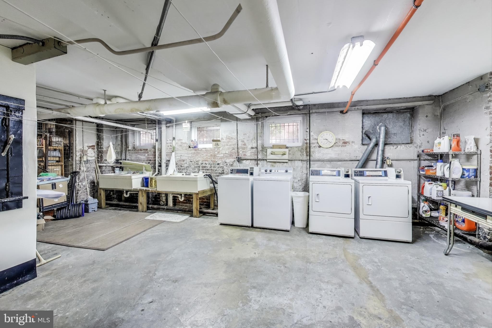 1791 Lanier Place Northwest, Unit 2 Washington, DC 20009 - Photo 25 of 30 a view of a storage & utility room with washer and dryer