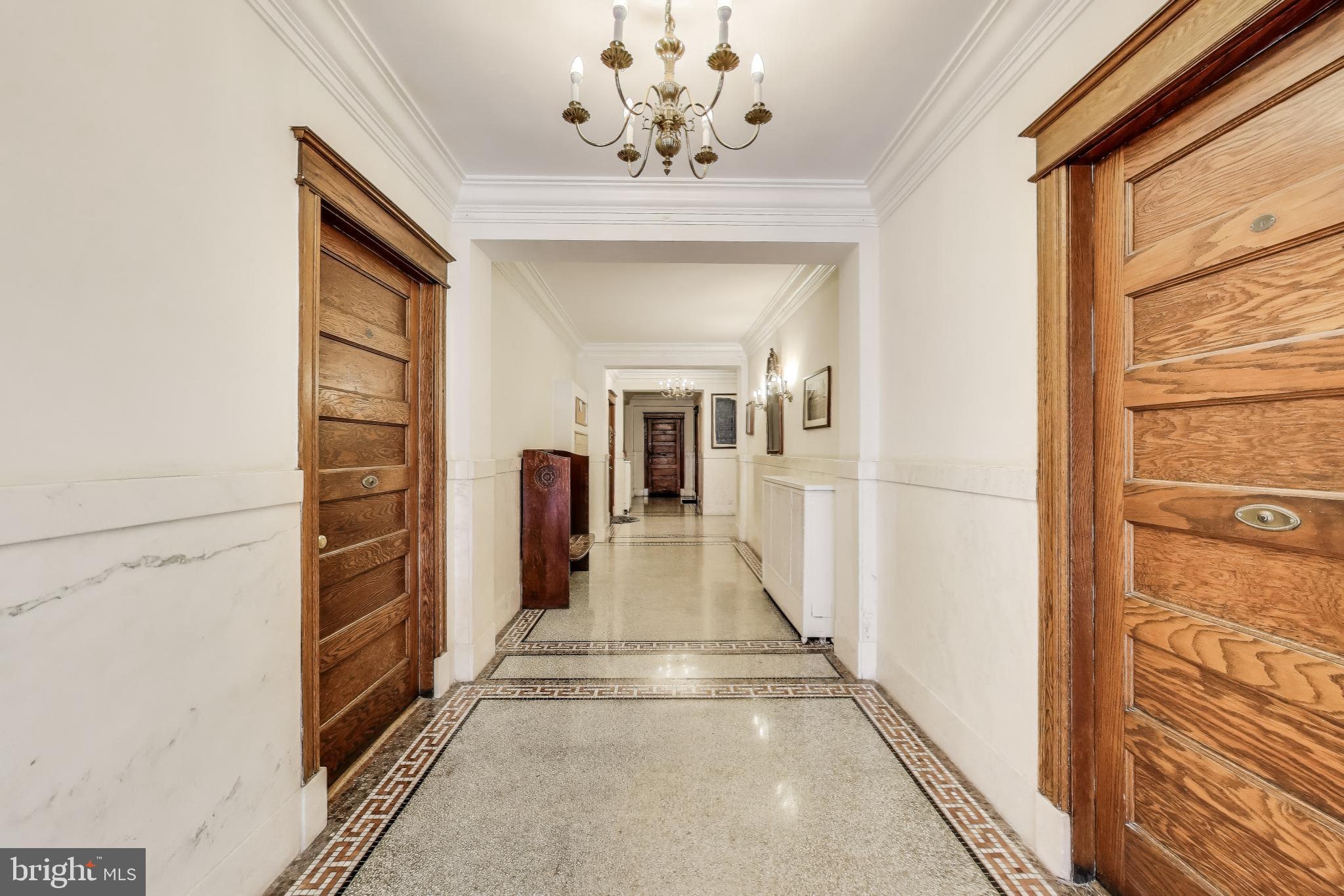1791 Lanier Place Northwest, Unit 2 Washington, DC 20009 - Photo 7 of 30 a view of a hallway with a chandelier