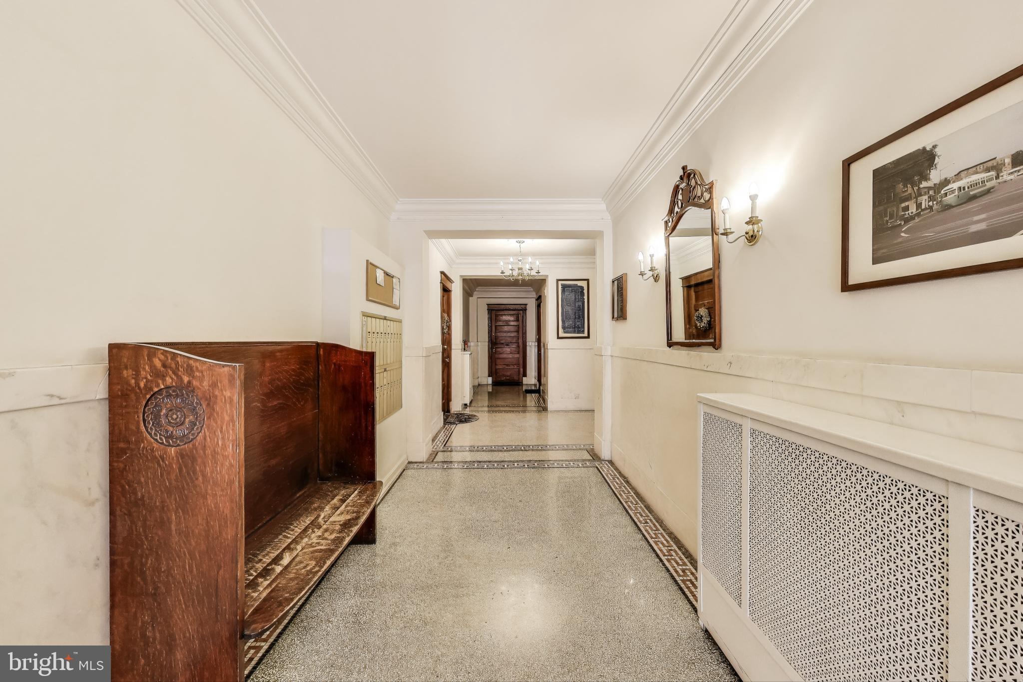 1791 Lanier Place Northwest, Unit 2 Washington, DC 20009 - Photo 8 of 30 a hallway with sliding door and bedroom