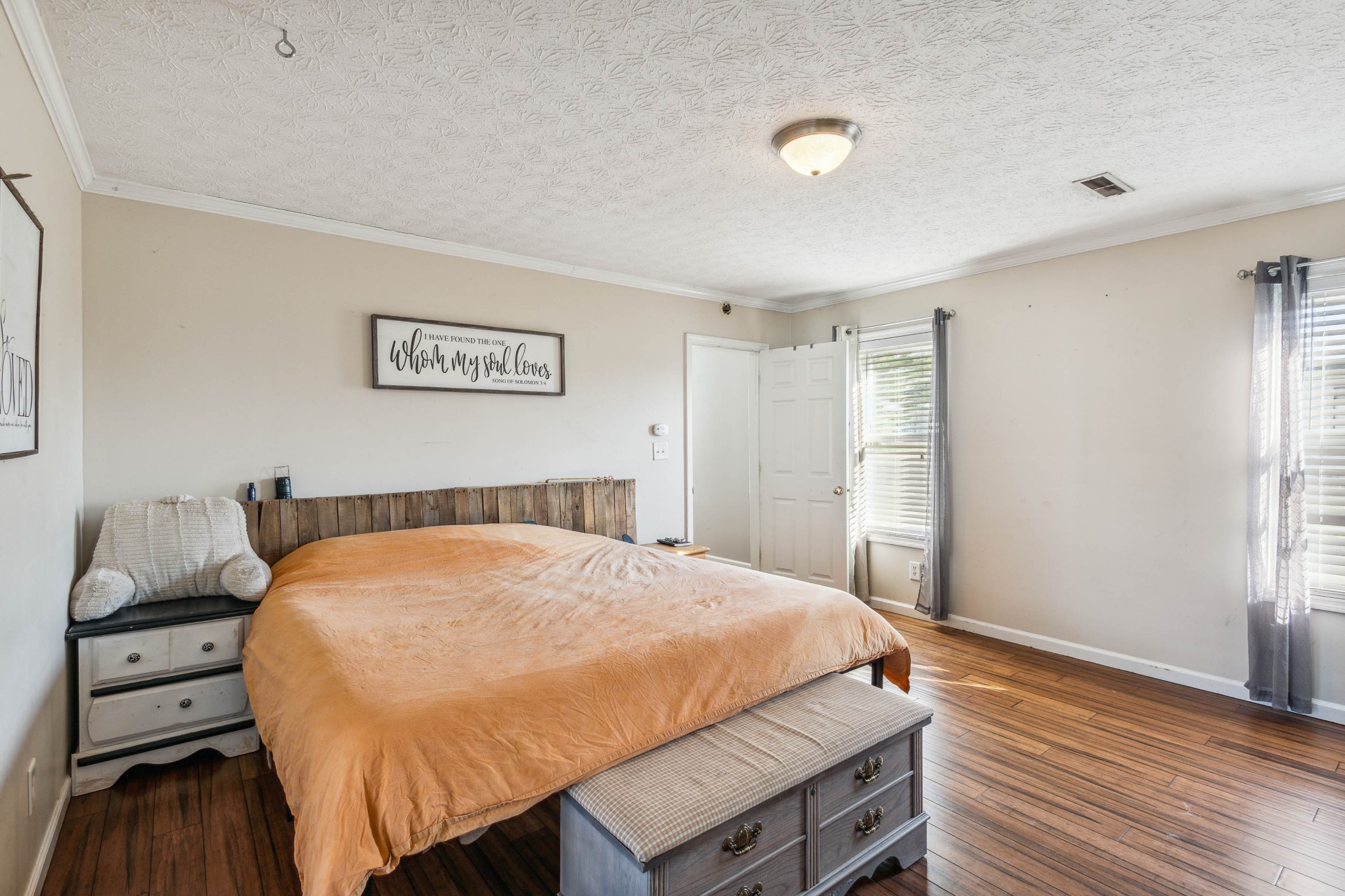 170 T G T Road Portland, TN 37148 - Photo 16 of 37 a bed sitting in a bedroom next to a window