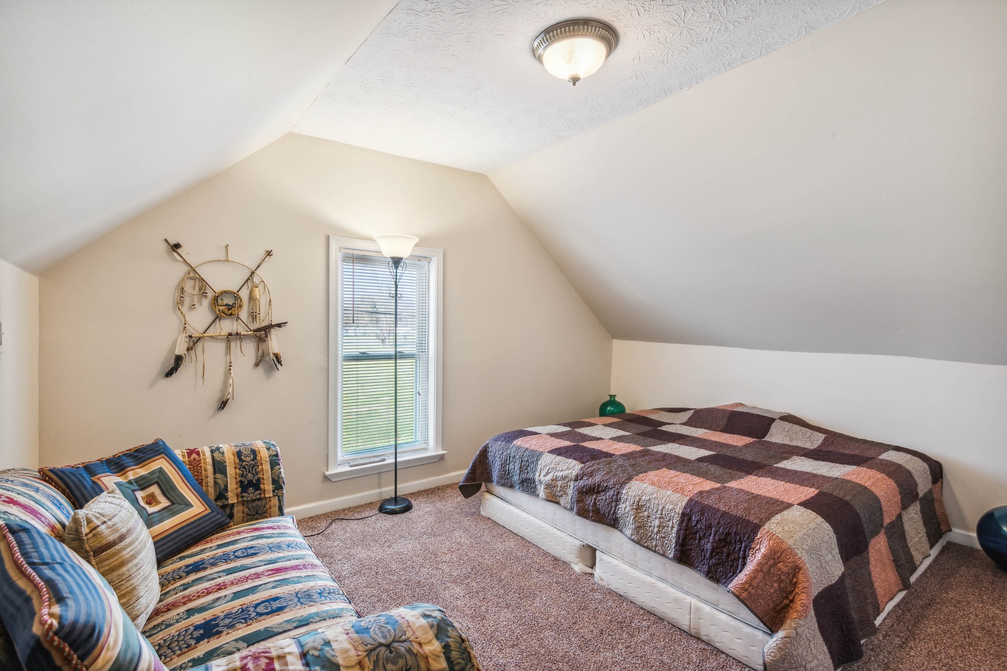 170 T G T Road Portland, TN 37148 - Photo 30 of 37 a bedroom with a bed and a window