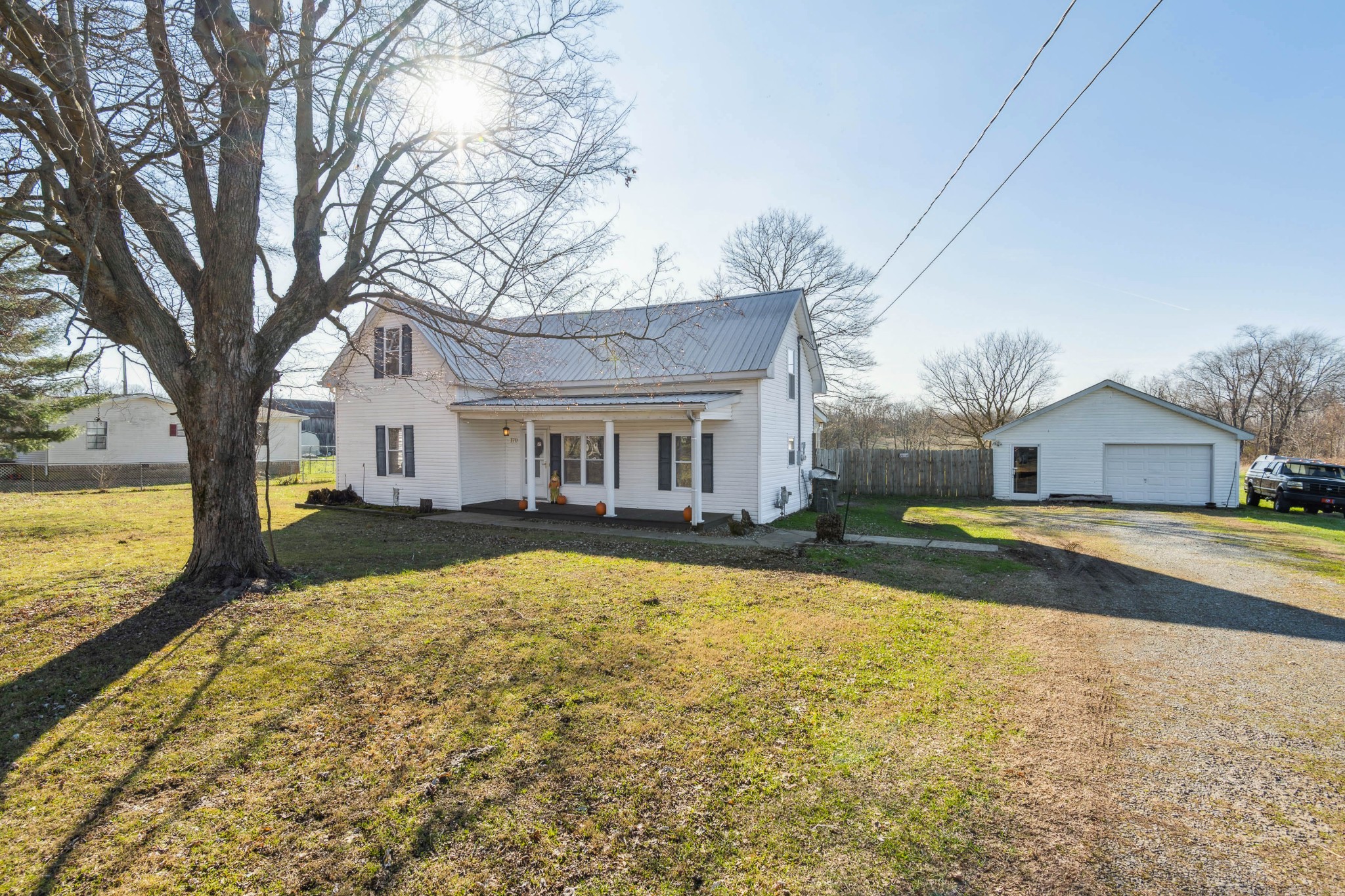170 T G T Road Portland, TN 37148 - Photo 3 of 37 a front view of a house with swimming pool and porch
