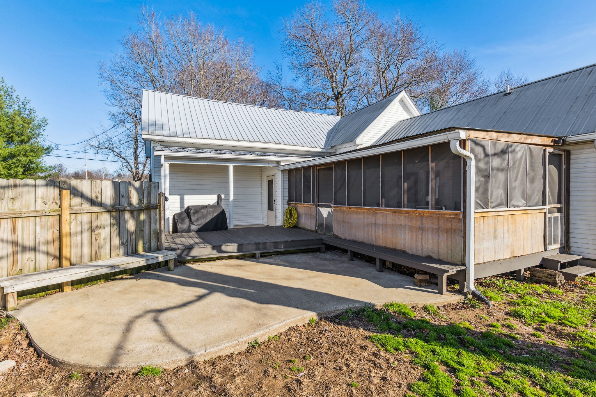 170 T G T Road Portland, TN 37148 - Photo 33 of 37 a view of a backyard with a small cabin and wooden fence