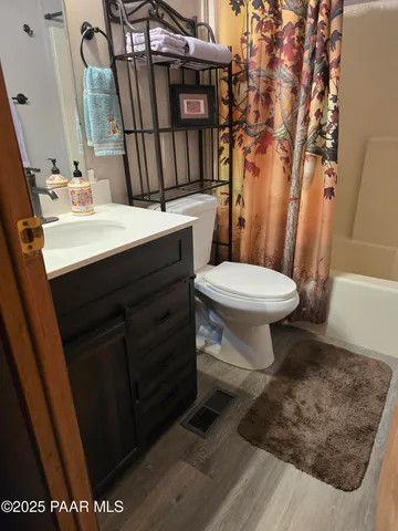 a couple of cars parked on the side of a street