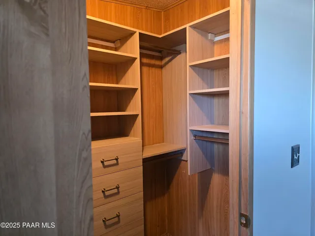 a view of a city with lush green forest