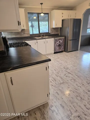 a view of a dining room with furniture window and outdoor kitchen