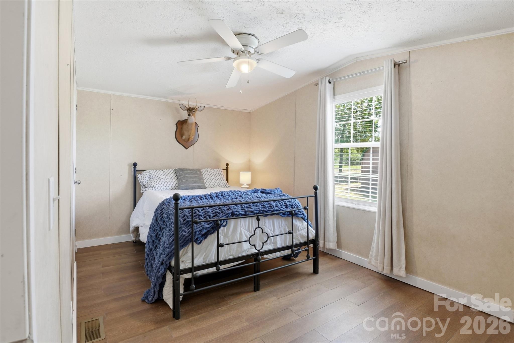 4406 Lucy Short Cut Road Marshville, NC 28103 - Photo 18 of 30 a bedroom with a bed and window