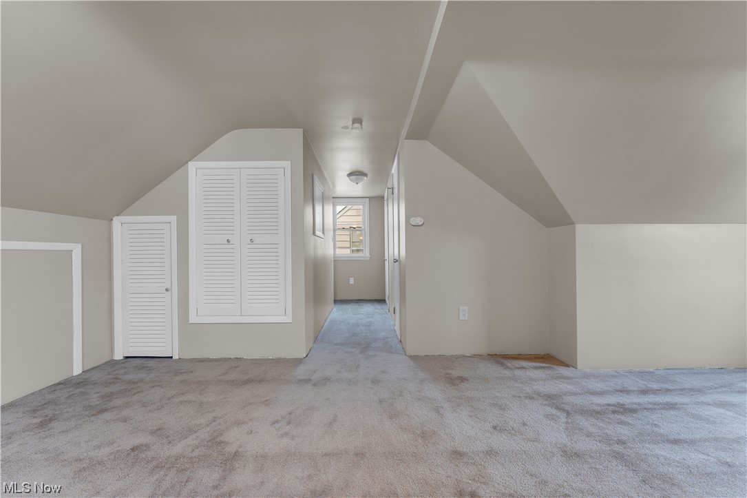 16301 Turney Road Maple Heights, OH 44137 - Photo 15 of 35 Bonus room featuring lofted ceiling and light carpet