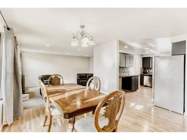 a living room with stainless steel appliances kitchen island granite countertop furniture and a kitchen view