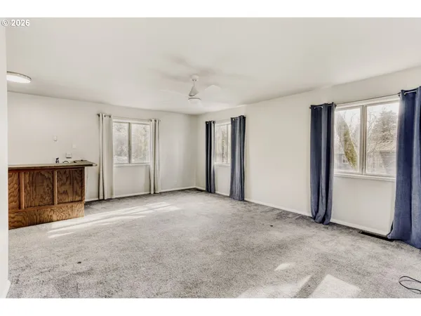 a view of an empty room with a window