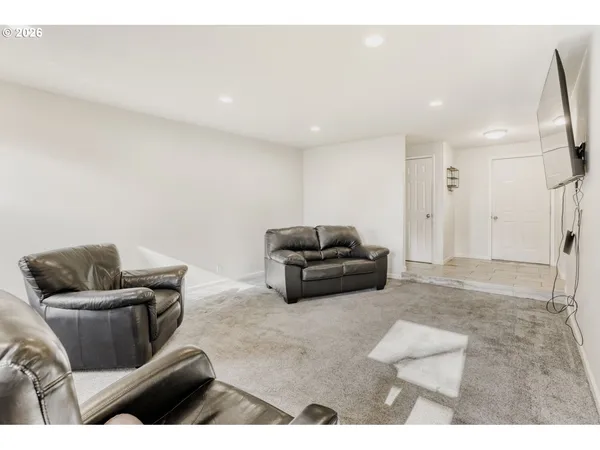 a living room with furniture and a couch