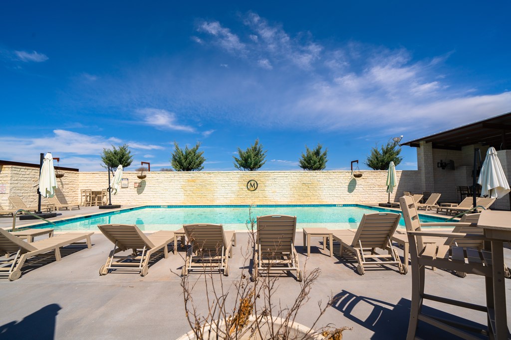 Lot 72 West Fallow Drive Harper, TX 78631 - Photo 14 of 30 a roof deck with table and chairs a barbeque with potted plants
