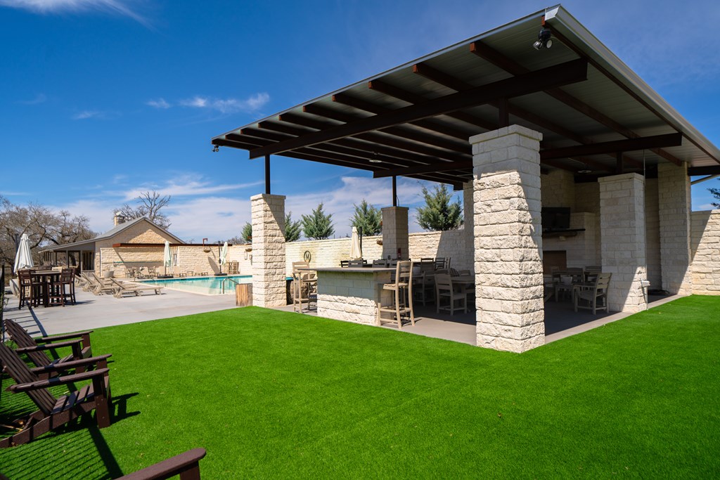 Lot 72 West Fallow Drive Harper, TX 78631 - Photo 17 of 30 a view of a backyard with wooden fence