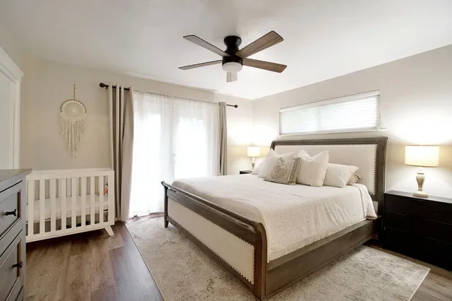 a bedroom with a bed and window