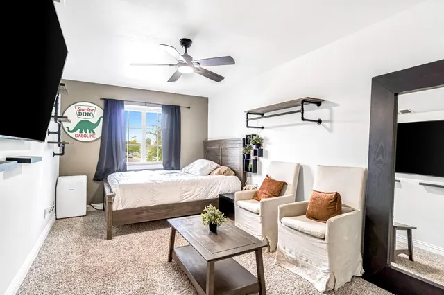 a bed room with a bed and a window