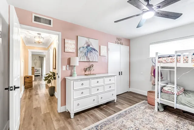 a bed room with a bed and a window