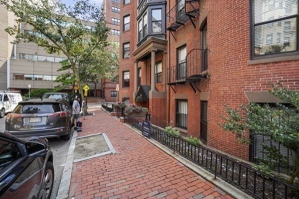 38-40 St Botolph Street, Unit 45 Boston, MA 02116 - Photo 6 of 8 a view of a brick building with many windows
