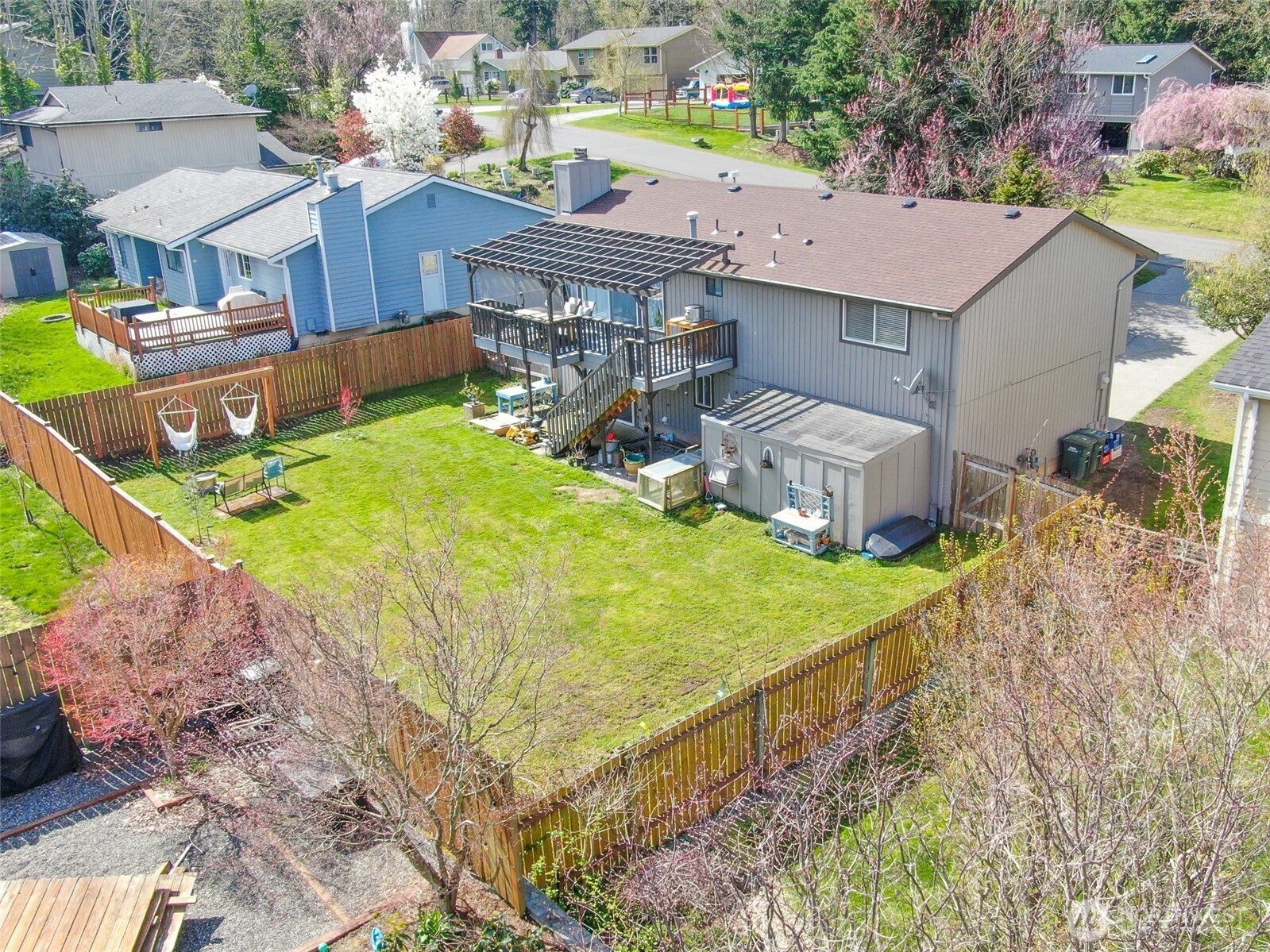 3780 Magrath Road Bellingham, WA 98226 - Photo 35 of 38 a view of a house with a yard and sitting area