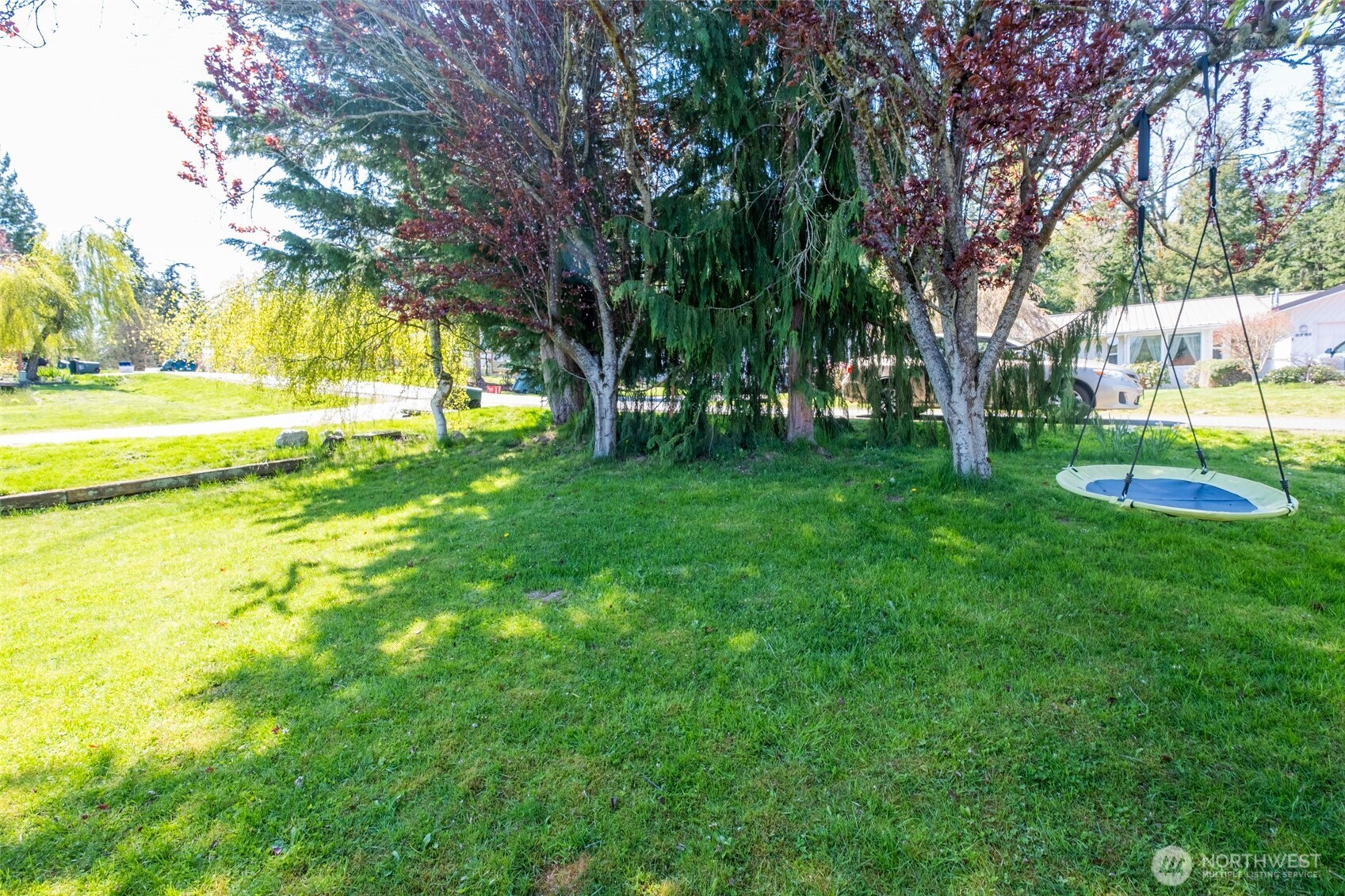 3780 Magrath Road Bellingham, WA 98226 - Photo 36 of 38 a view of a swimming pool with a garden and trees