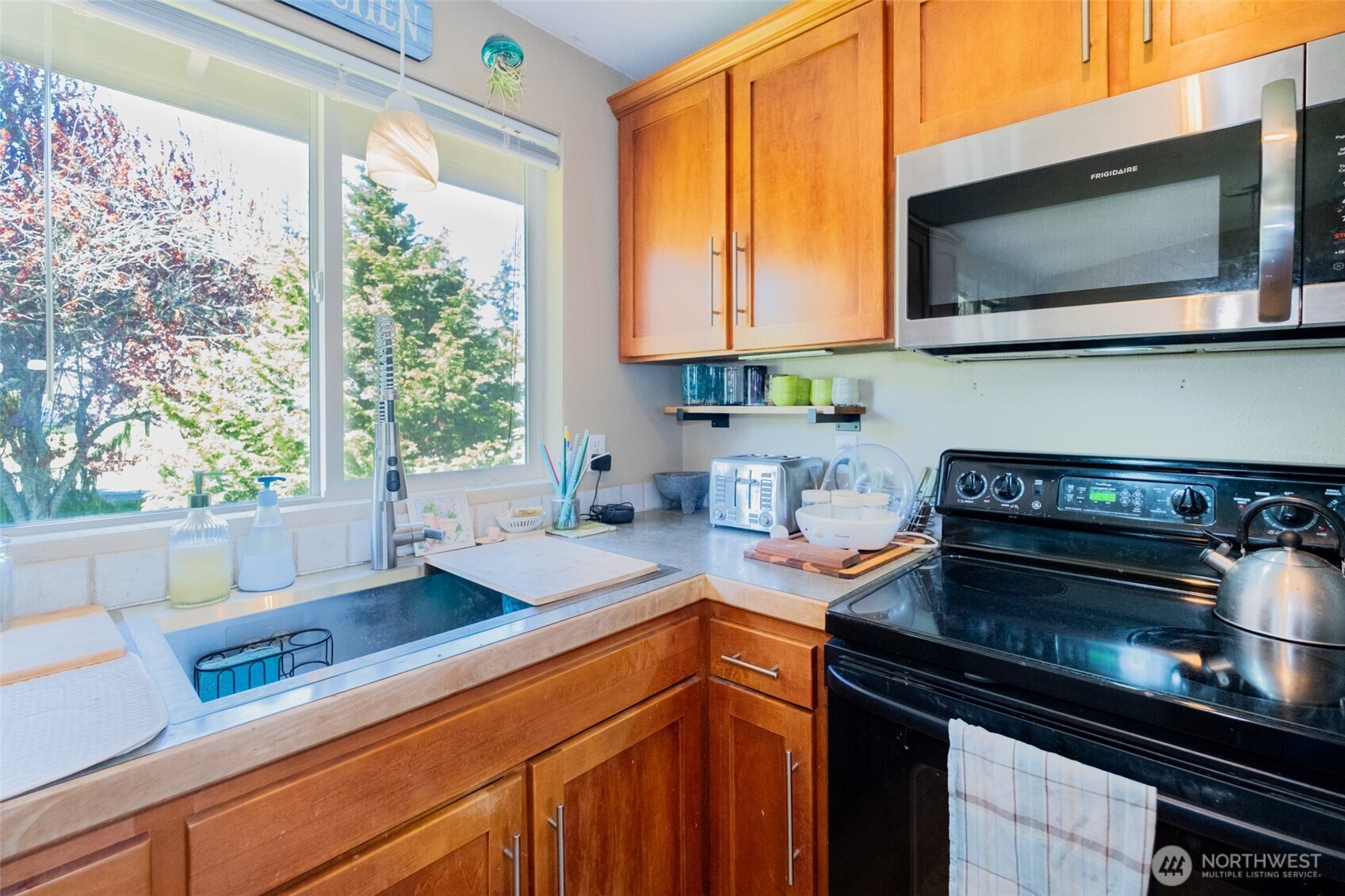 3780 Magrath Road Bellingham, WA 98226 - Photo 9 of 38 a kitchen that has a sink and a stove top oven