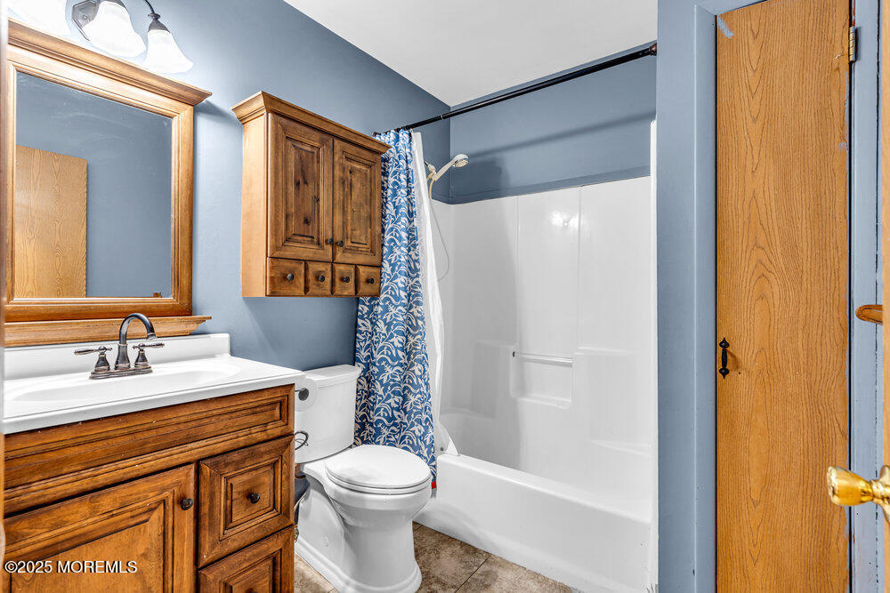 10 Bowman Road Jackson, NJ 08527 - Photo 11 of 16 a bathroom with a granite countertop sink toilet and shower