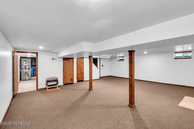 a view of a livingroom with furniture and a window