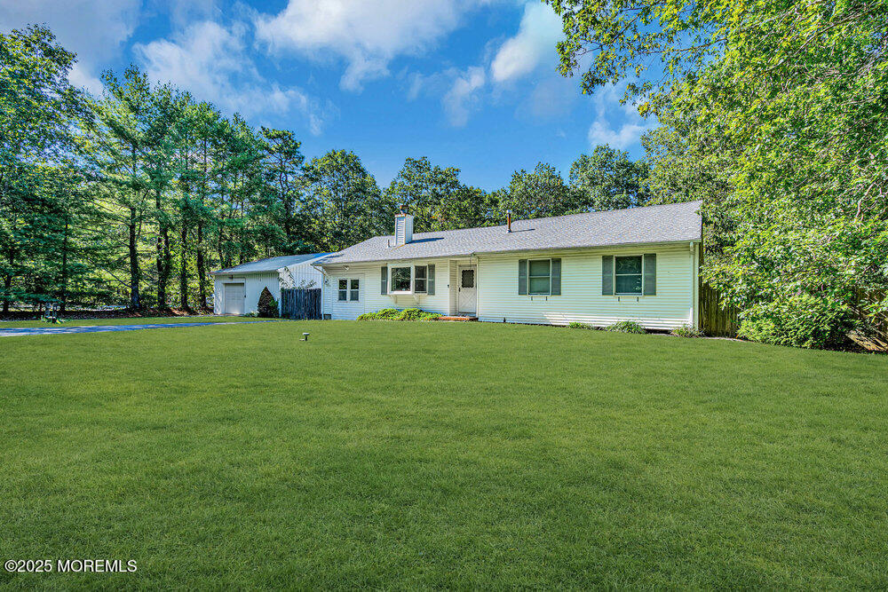 10 Bowman Road Jackson, NJ 08527 - Photo 2 of 16 a front view of house with yard and green space