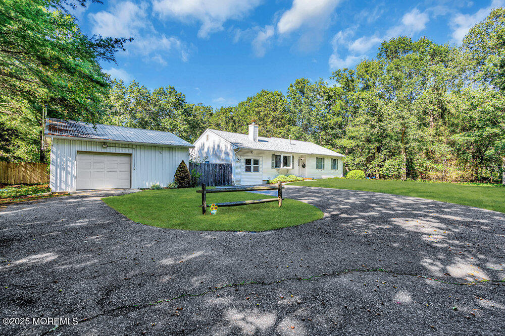 10 Bowman Road Jackson, NJ 08527 - Photo 3 of 16 a front view of house with yard and green space