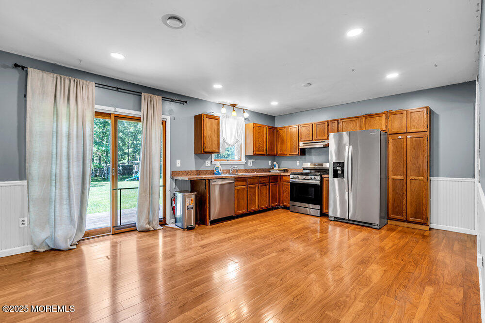 10 Bowman Road Jackson, NJ 08527 - Photo 5 of 16 a kitchen with stainless steel appliances granite countertop a refrigerator and a stove top oven