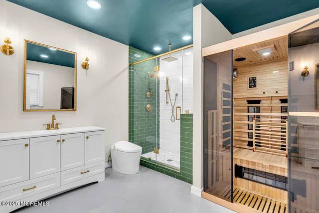 a bathroom with a toilet sink and shower