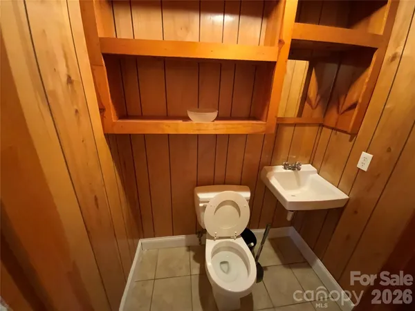 a bathroom with a toilet and a sink