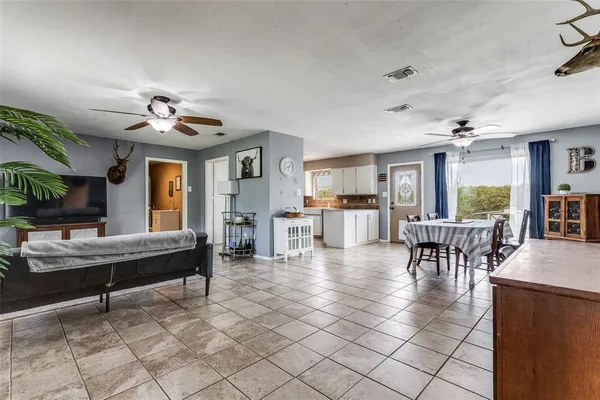 a view of a livingroom with furniture and a table