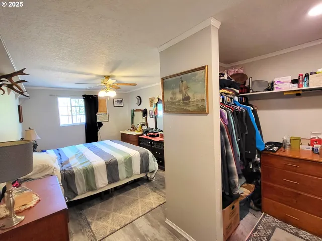 a bedroom with a bed and a closet