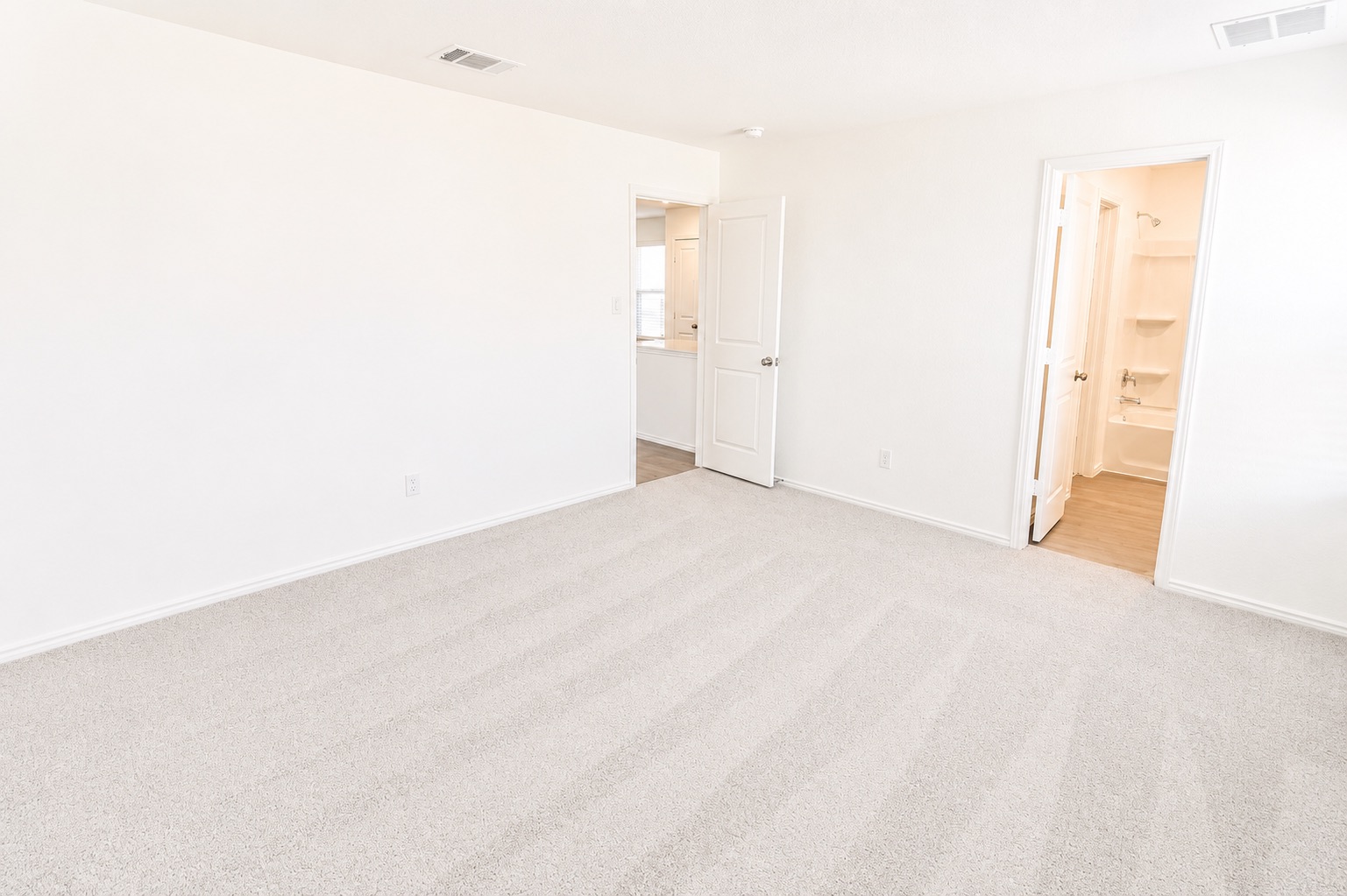 397 Keefer Kyle, TX 78640 - Photo 29 of 33 A spacious room offers comfortable carpet flooring and a neutral palette, awaiting personalization.