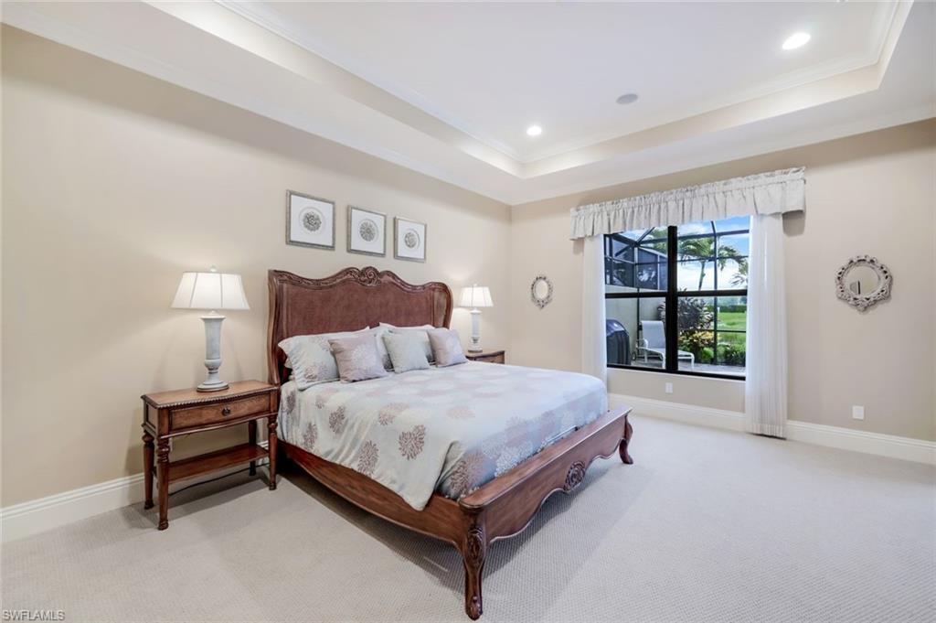 7598 Moorgate Point Way Naples, FL 34113 - Photo 11 of 33 a spacious bedroom with a bed and a window