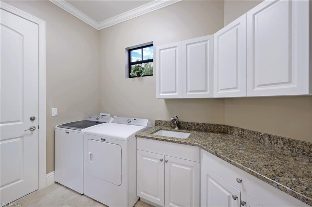 7598 Moorgate Point Way Naples, FL 34113 - Photo 21 of 33 a utility room with sink dryer and washer
