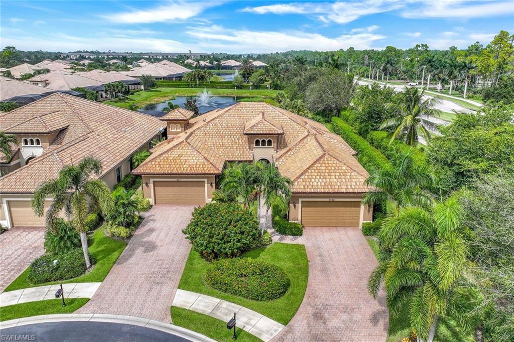 7598 Moorgate Point Way Naples, FL 34113 - Photo 28 of 33 an aerial view of a house