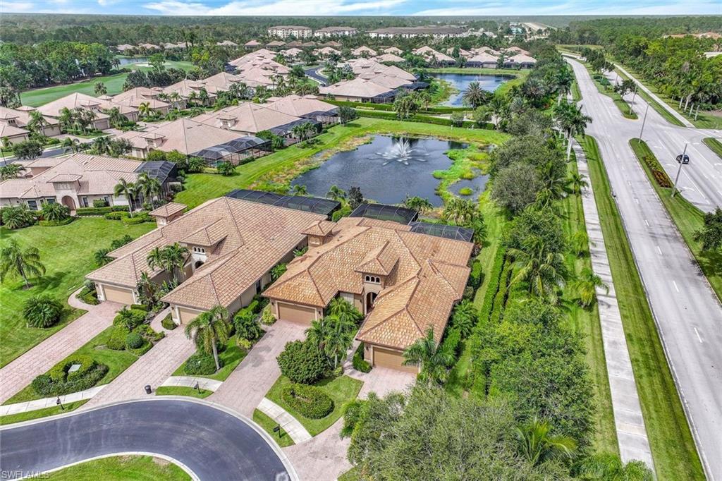 7598 Moorgate Point Way Naples, FL 34113 - Photo 31 of 33 an aerial view of residential houses with outdoor space