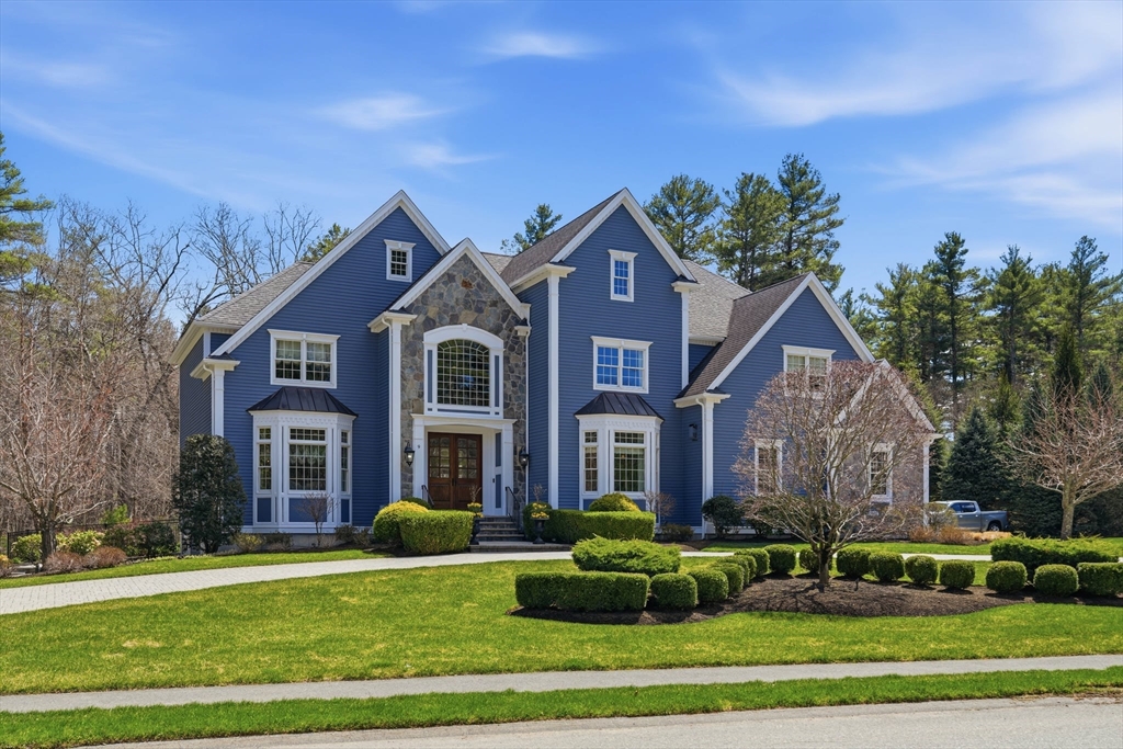 a front view of a house with a yard