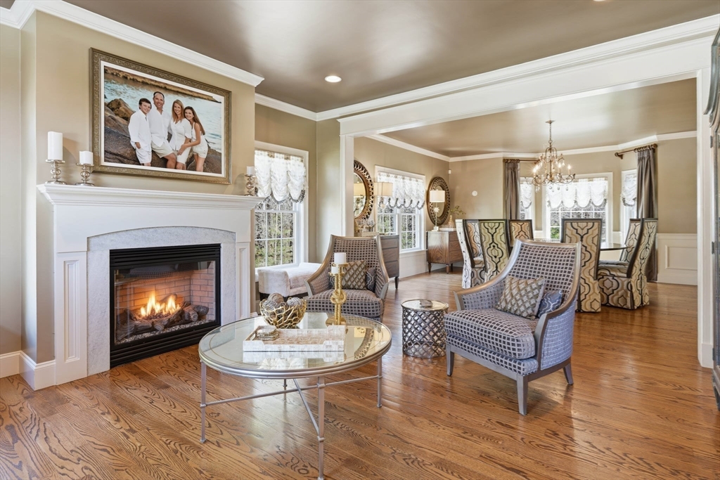 9 Ross Lane Middleton, MA 01949 - Photo 12 of 42 a living room with furniture and a fireplace