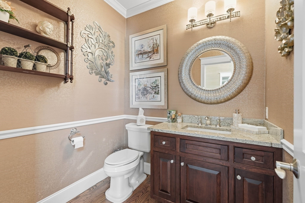 9 Ross Lane Middleton, MA 01949 - Photo 15 of 42 a bathroom with a toilet a sink and a mirror