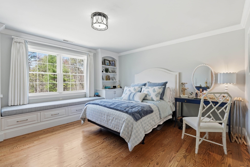 9 Ross Lane Middleton, MA 01949 - Photo 22 of 42 a spacious bedroom with a bed and a large window