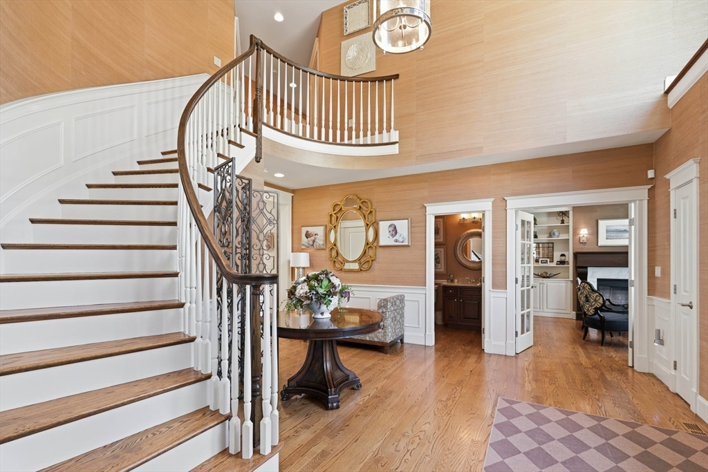 9 Ross Lane Middleton, MA 01949 - Photo 3 of 42 a view of entryway livingroom and hall with wooden floor