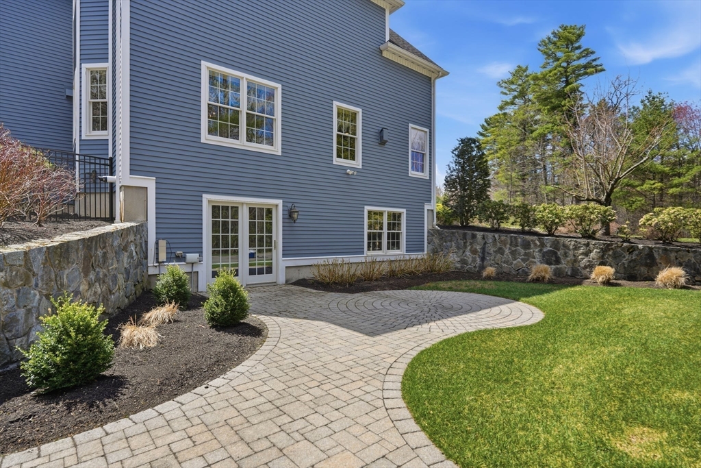 9 Ross Lane Middleton, MA 01949 - Photo 36 of 42 a front view of a house with garden