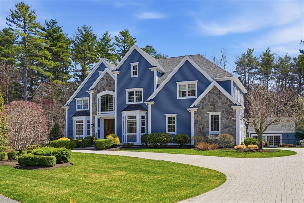 9 Ross Lane Middleton, MA 01949 - Photo 40 of 42 a front view of a house with a yard