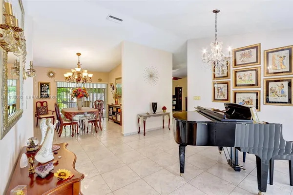a view of a livingroom with furniture and chandelier