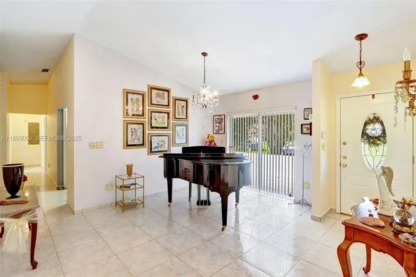 a dining room with furniture and window
