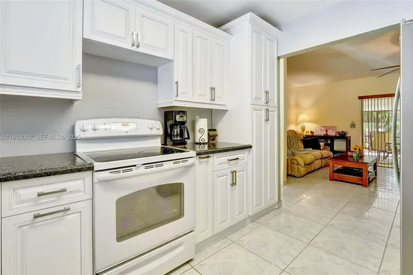 a kitchen with cabinets and appliances
